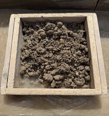 Wooden screen box filled with sapphire gravel 